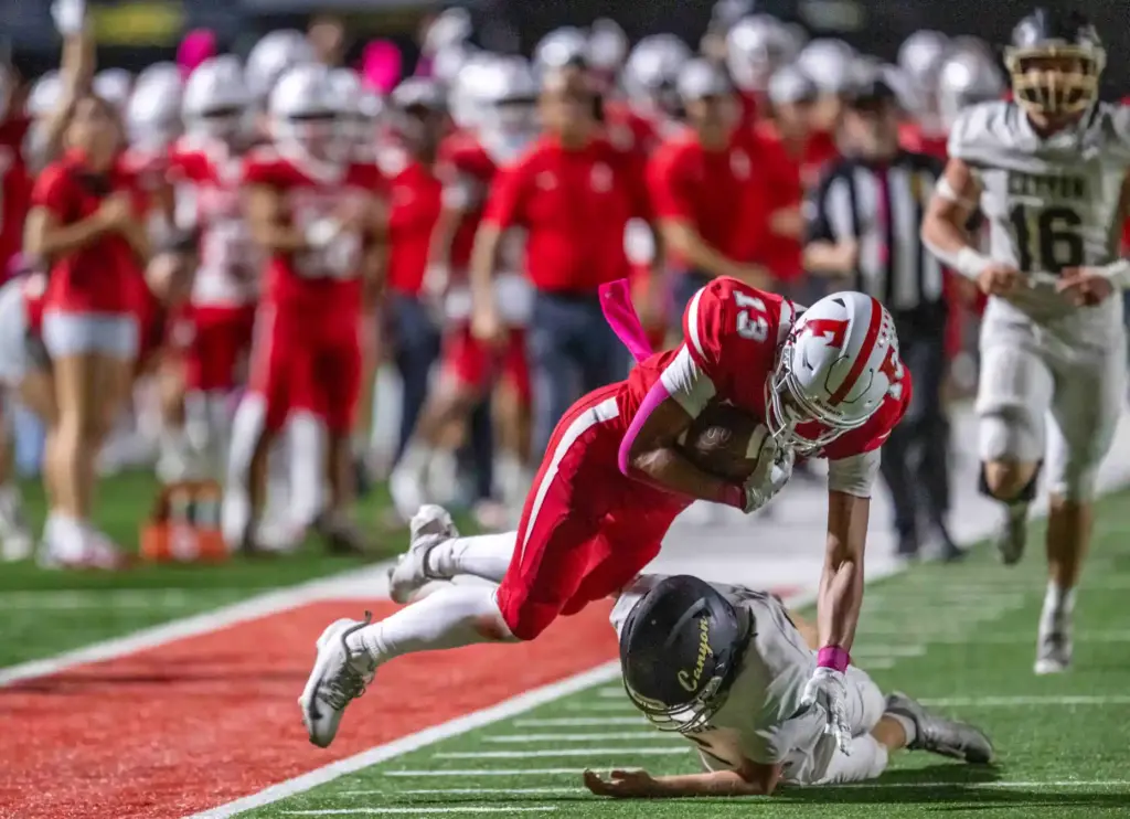 Fullerton tight end Isaac Garza (13) goes airborne to pick...