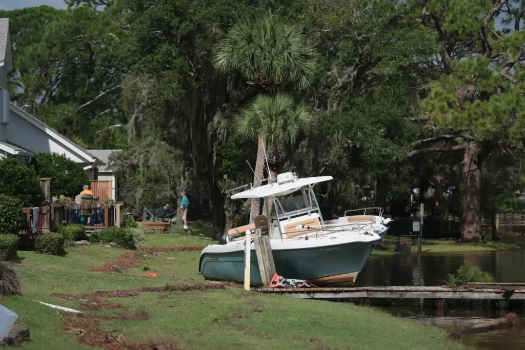 A boat rests on dry land after Hurricane Isaias passed...