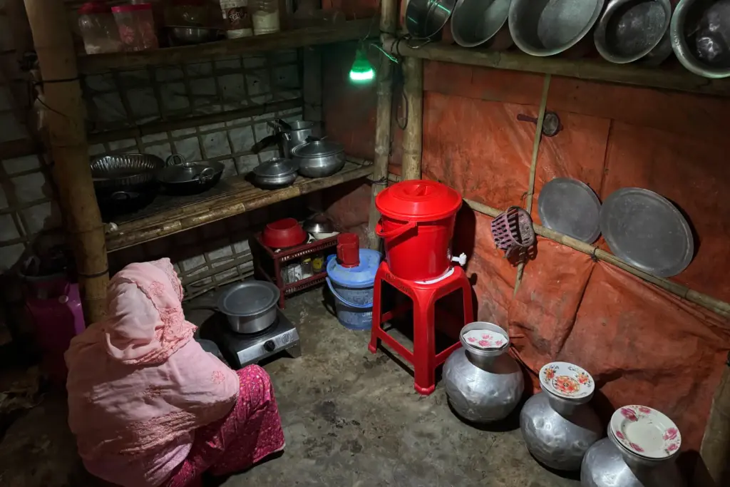 In this photo taken with a phone, a woman uses...