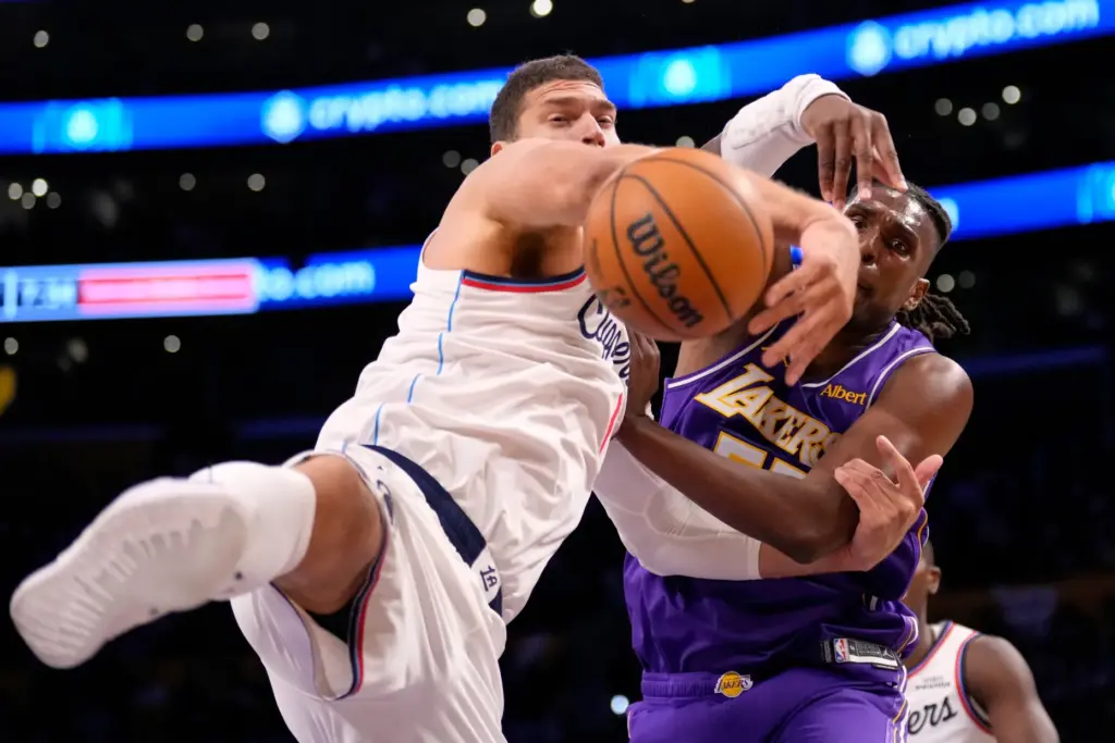 Clippers center Brook Lopez, left, and Lakers forward/center Kevon Looney...