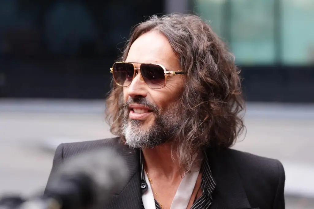 Russell Brand speaks to the media as he arrives at Southwark Crown Court.