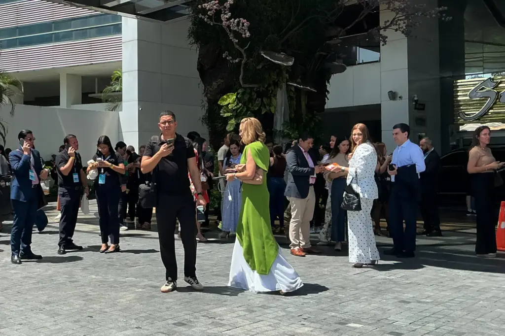 People stand outside a building after an earthquake struck Panama...