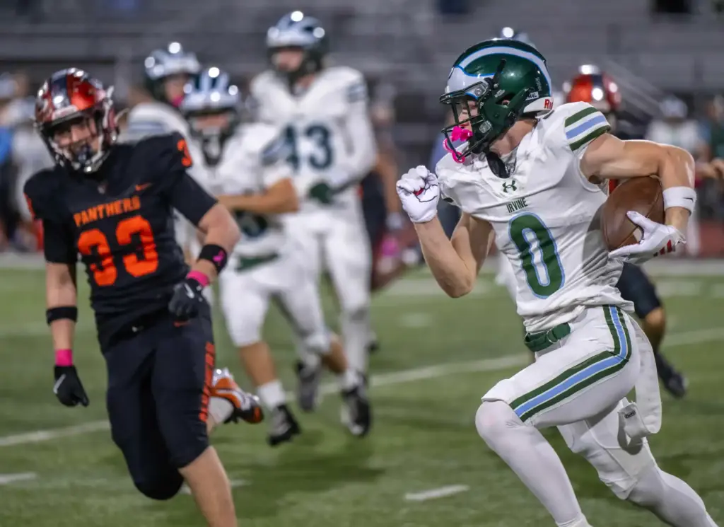 Irvine wide receiver Kyle Fogarty (0) carries the ball during...