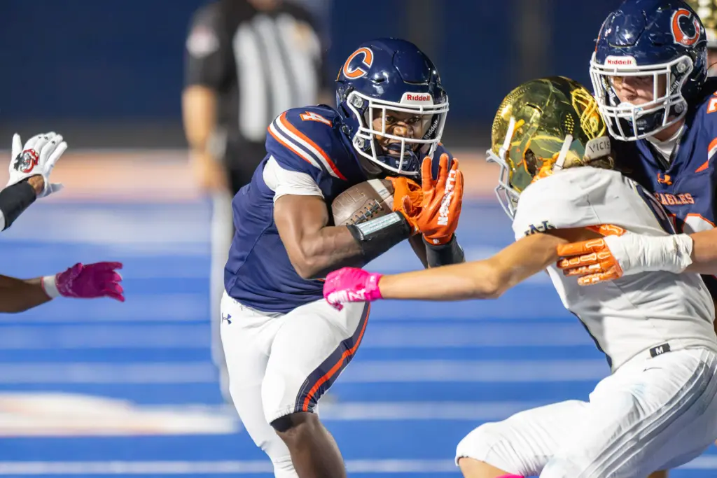 Chaminade High Schoolâs Marquis Jones (4) carries the ball as...