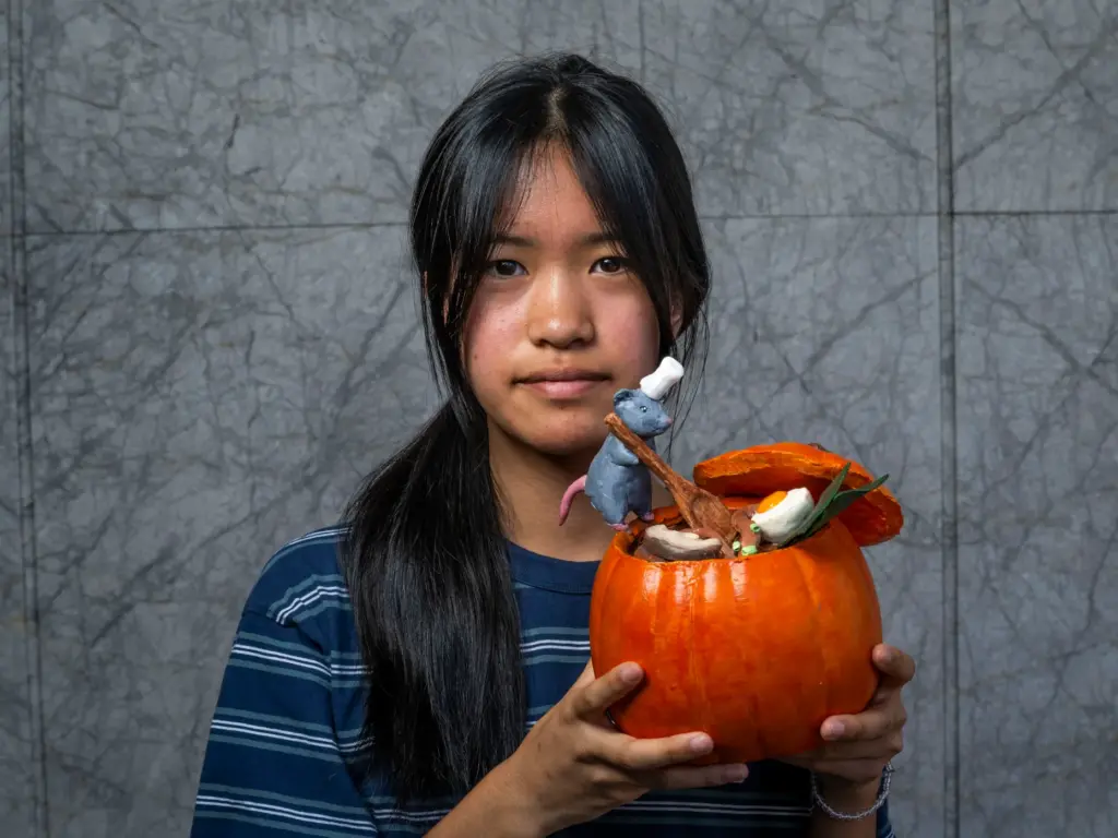 Riley Ohara holds her pumpkin titled âMaster Chefâ which she...