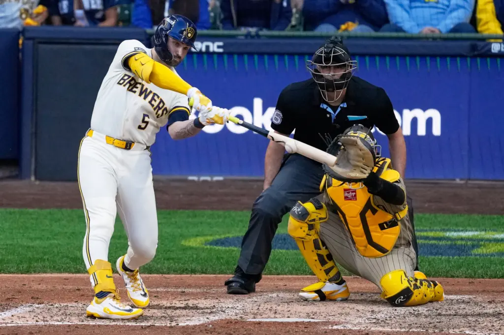 The Milwaukee Brewers’ Garrett Mitchell hits a single during the...