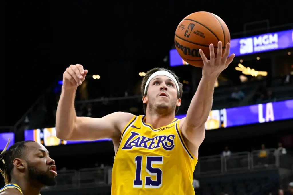 Lakers guard Austin Reaves drives to the basket during the...