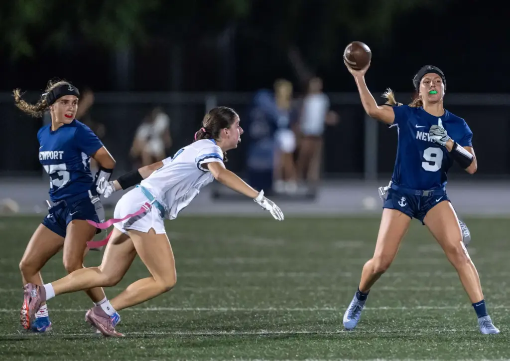 Newport Harbor quarterback Scarlett Guyser (9) throws the ball during...