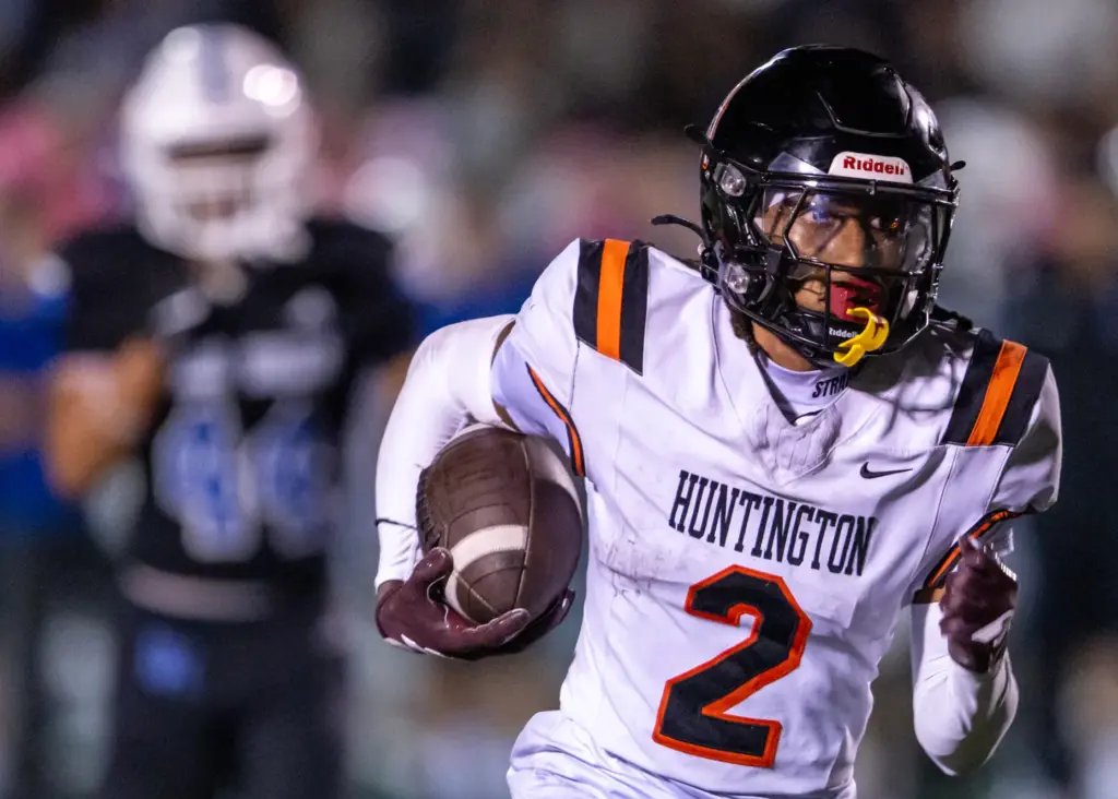 Huntington Beachâs Dylin Bruce (2) carries the ball during a...