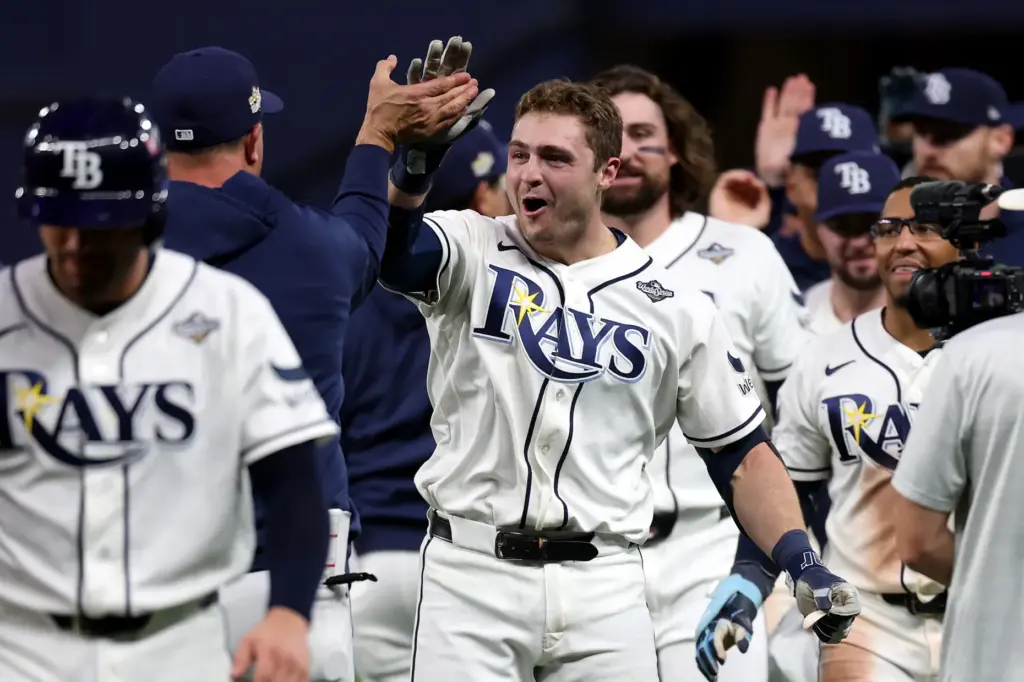 The Tampa Bay Rays’ Ben Williamson, center, celebrates with teammates...