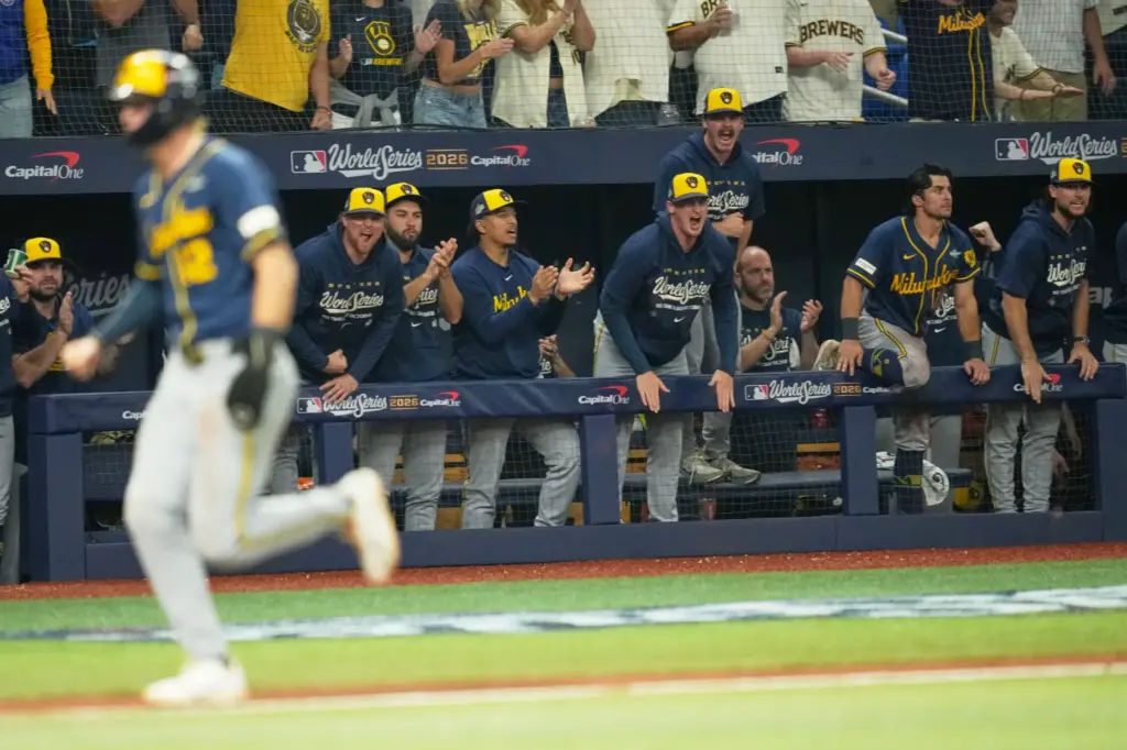 The Milwaukee Brewers celebrate an RBI single by David Hamilton...