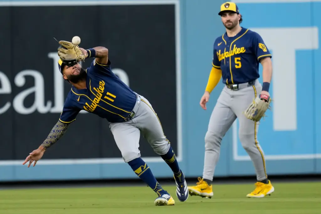 Milwaukee Brewers left fielder Jackson Chourio catches a fly ball...
