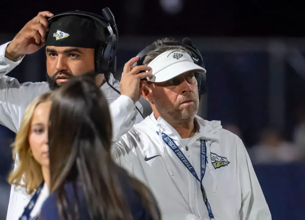 St. John Bosco coach Jason Negro, right, during the game...