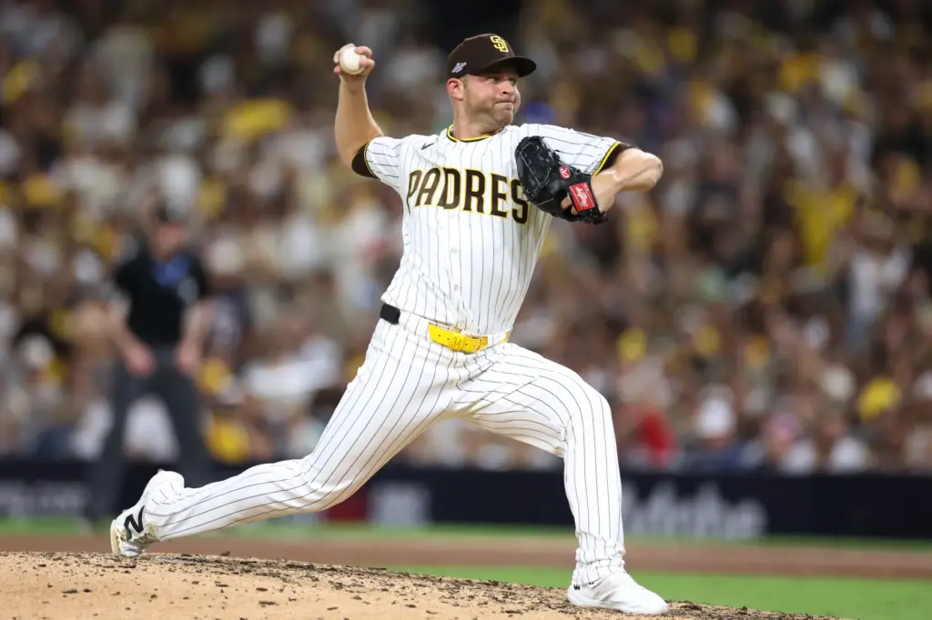San Diego Padres pitcher Michael King throws to the plate...