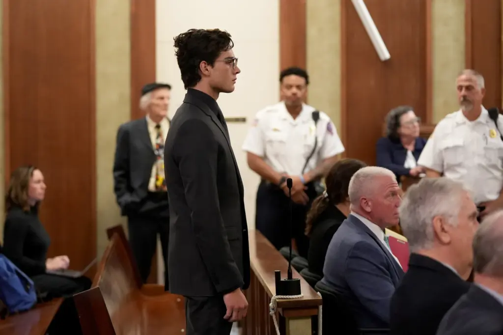 Braden Peters, also known as Clavicular, stands at the microphone during his arraignment.