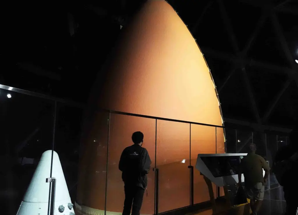Visitors walk an observation deck to see Endeavour on display...