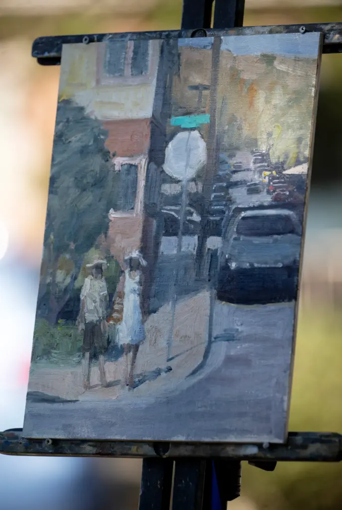 Terry Miura paints a street scene during the Laguna Beach...