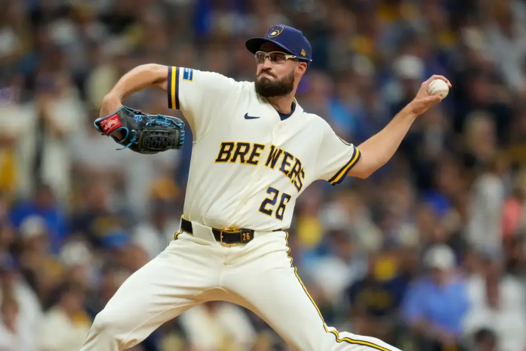 Milwaukee Brewers relief pitcher Aaron Ashby throws to the plate...