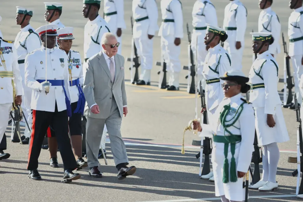 Britain’s King Charles III inspects an honor guard at the...