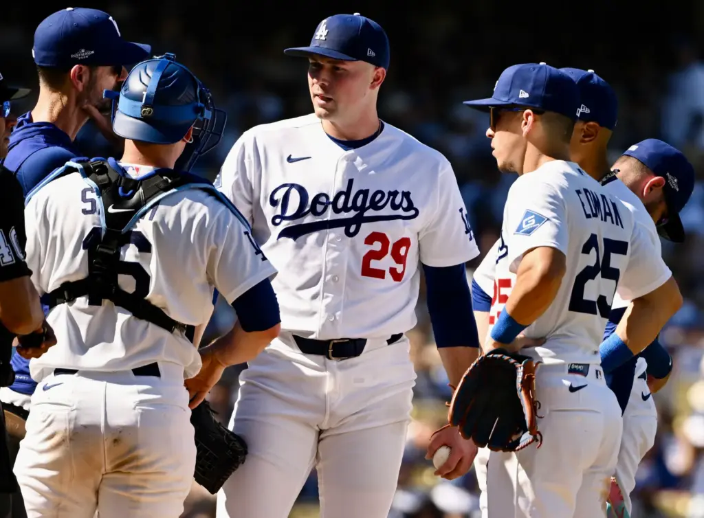 Dodgers pitching coach Mark Prior, far left, talks with starting...