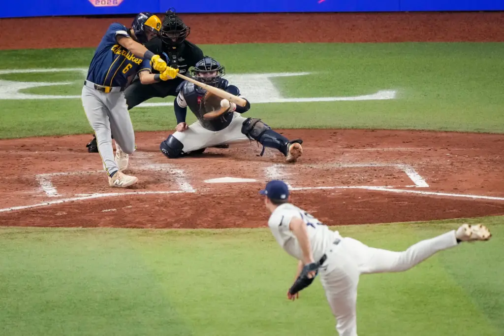 The Milwaukee Brewers’ David Hamilton follows through on an RBI...