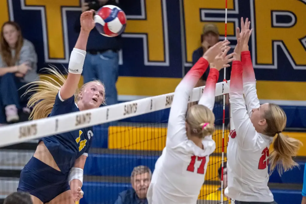 Crean Lutheran outside hitter Brooklyn Jones (14) hits the ball...