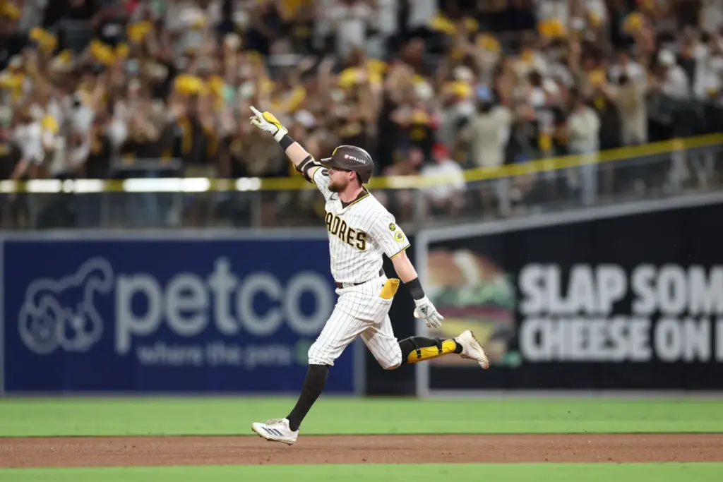 The San Diego Padres’ Jake Cronenworth celebrates as he rounds...