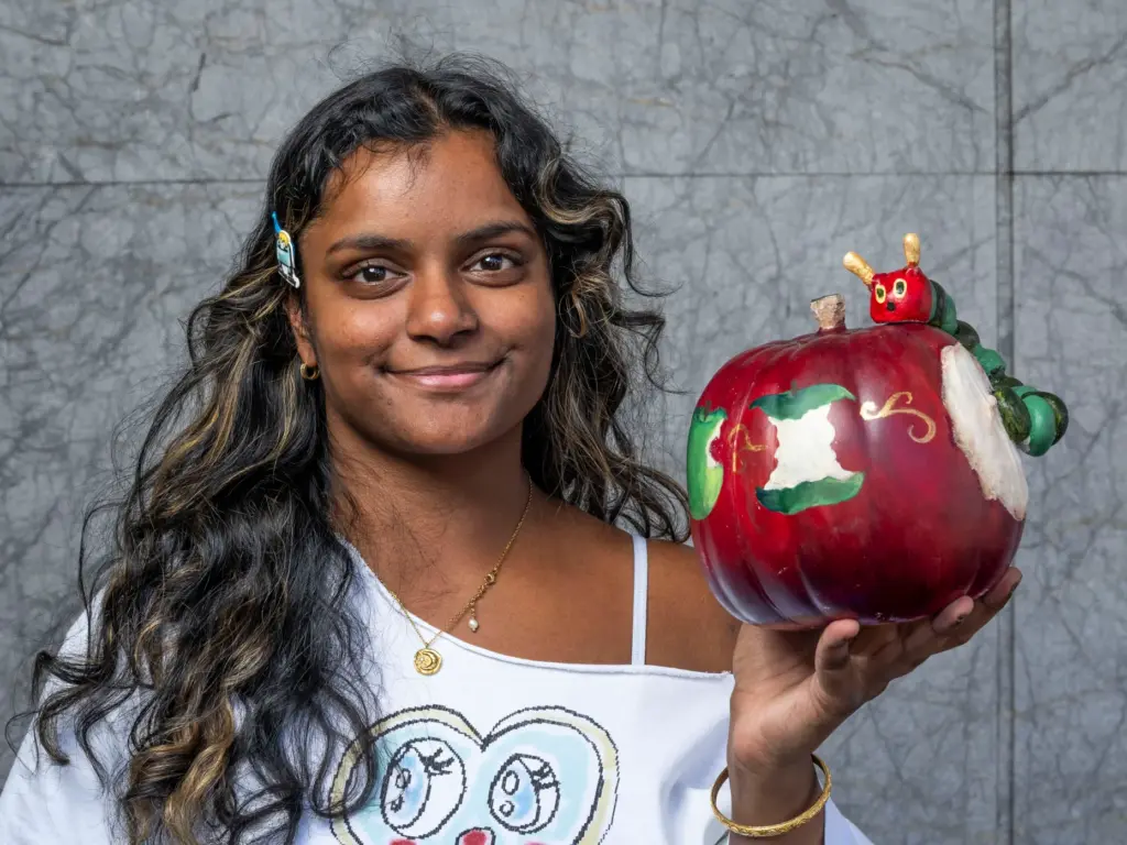 Shivani Atluri holds her pumpkin titled âThe Very Hungry Caterpillarâ...