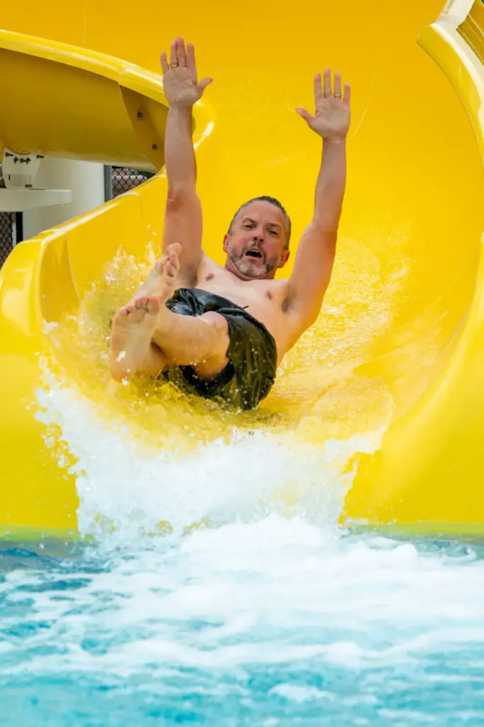 Santa Ana City Council Member Phil Bacerra raises his arms...