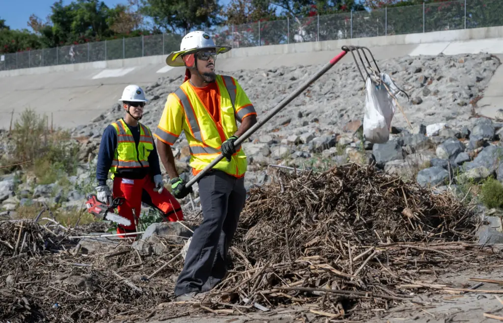 Vegetation and trash is cleared from the San Juan and...