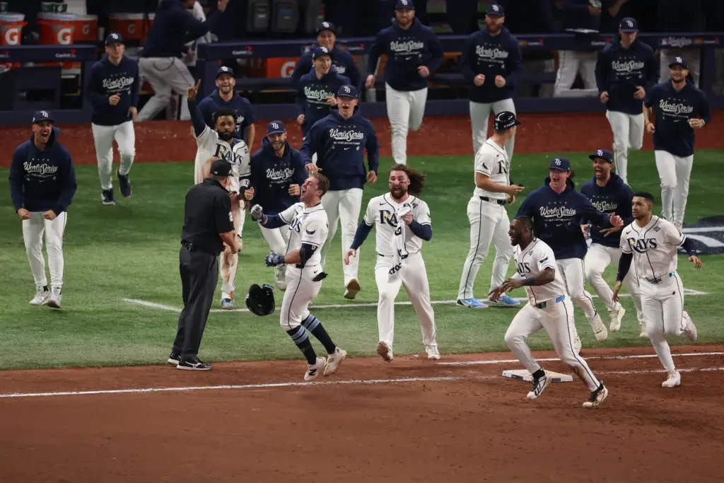 The Tampa Bay Rays’ Ben Williamson (15) celebrates with teammates...