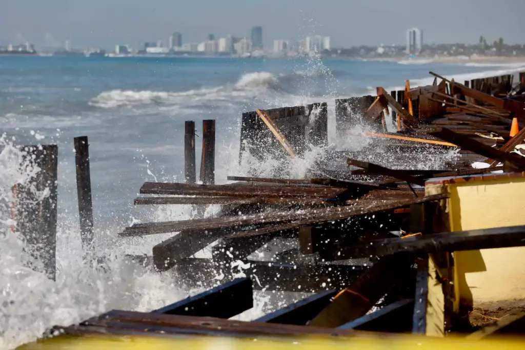 Waves continue to crash into the already heavily damaged boardwalk...