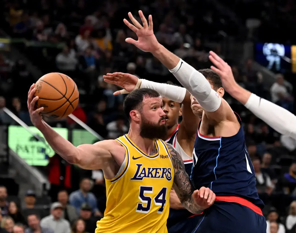 Lakers forward Sandro Mamukelashvili looks to pass the ball as...