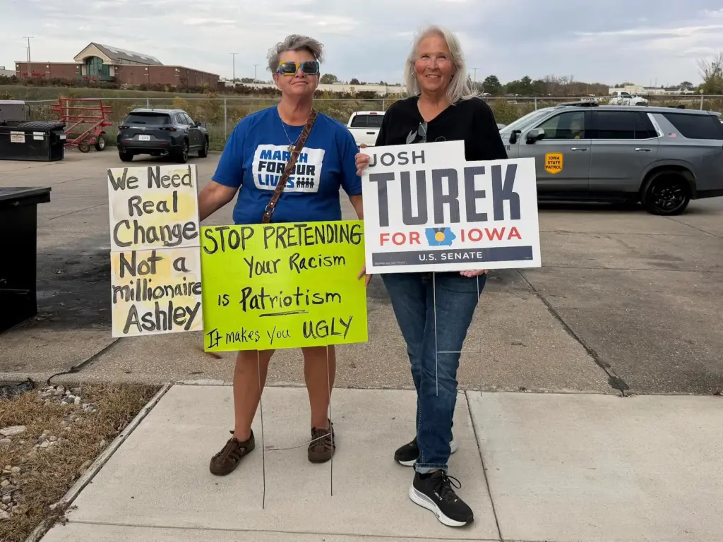 In this photo taken with a smart phone, Iowans Valerie...