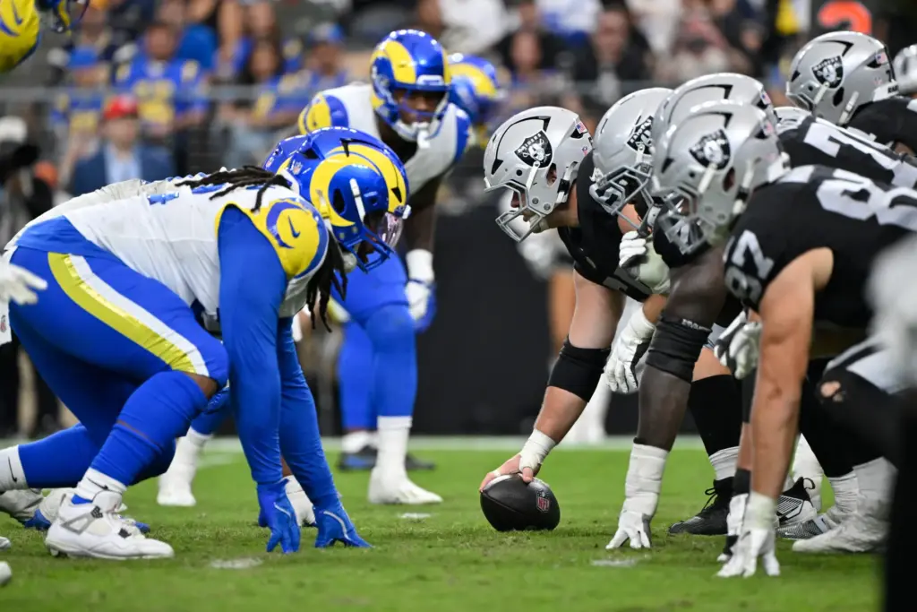 Las Vegas Raiders center Tyler Linderbaum, center right, prepares to...