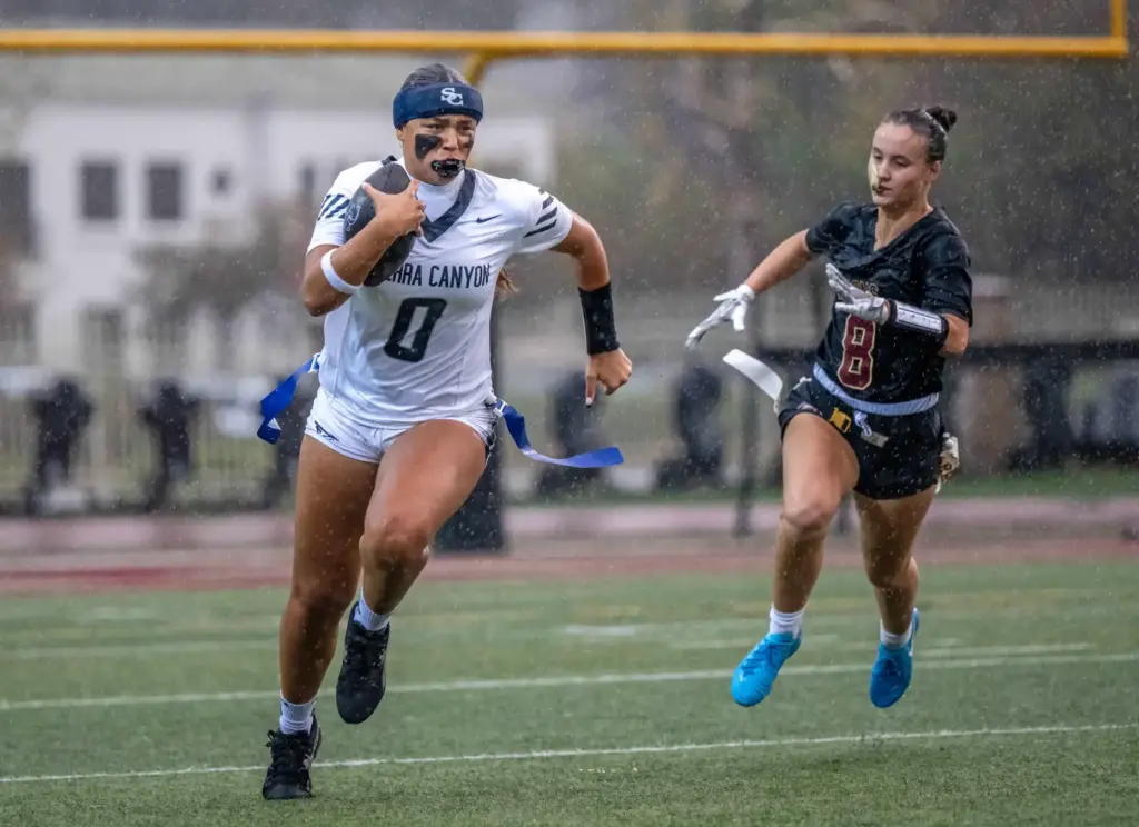 Sierra Canyon quarterback Makena Cook (0) carries the ball on...