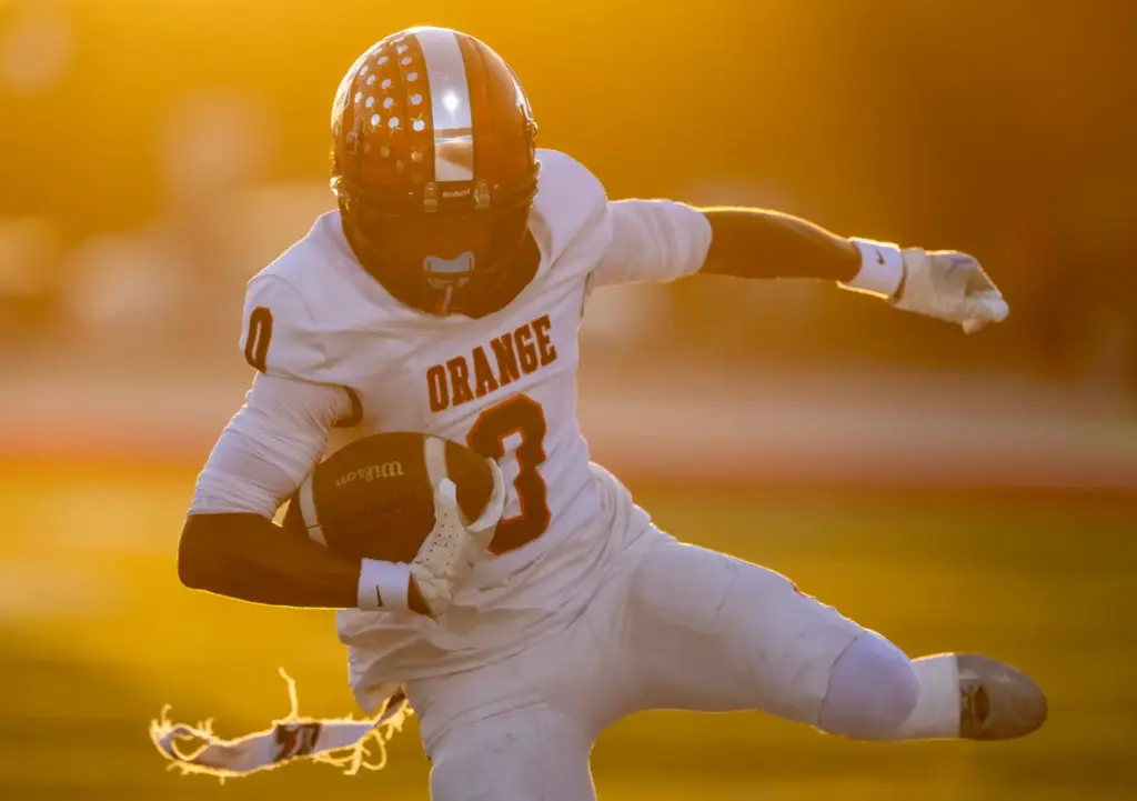 Orange wide receiver Malahki Allen (0) carries the ball while...