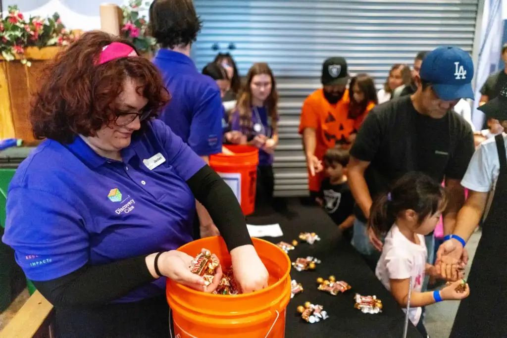 Jaiden Ihda collects candy to give to trick-or-treaters after the...