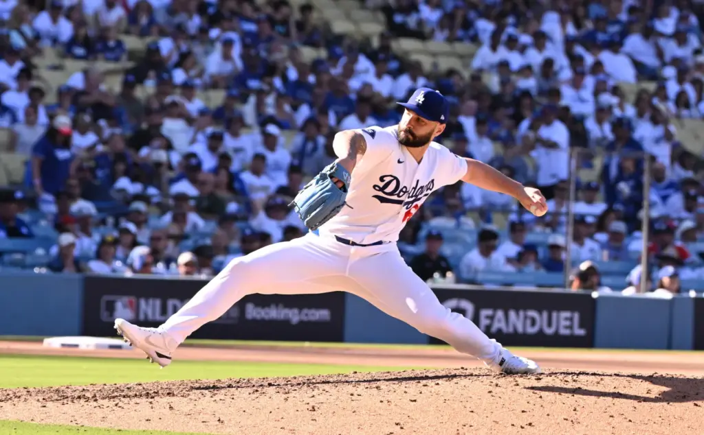 Dodgers relief pitcher Tanner Scott throws to the plate during...