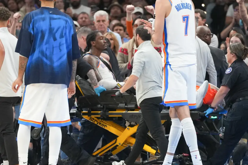 Oklahoma City Thunder guard Jalen Williams is taken off the...