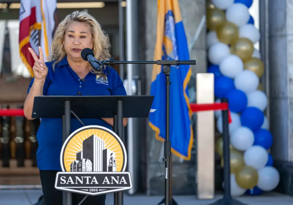 Santa Ana Mayor Valerie Amezcua welcomes guests to a ribbon...