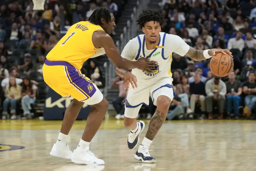 Golden State Warriors rookie forward Yaxel Lendeborg brings the ball...