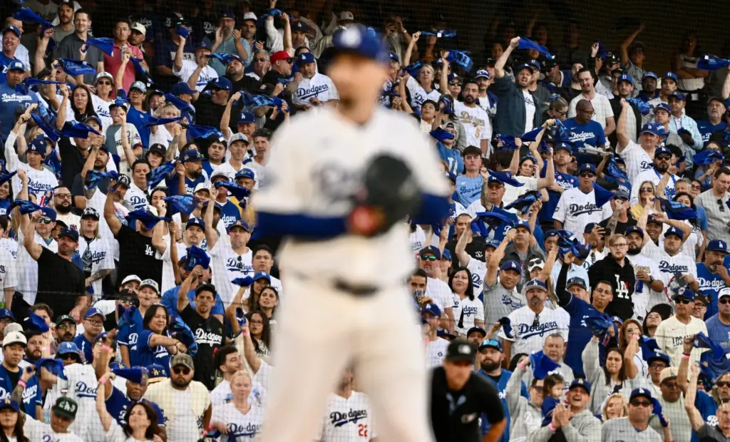 Dodgers starting pitcher Blake Snell prepares to throw to the...