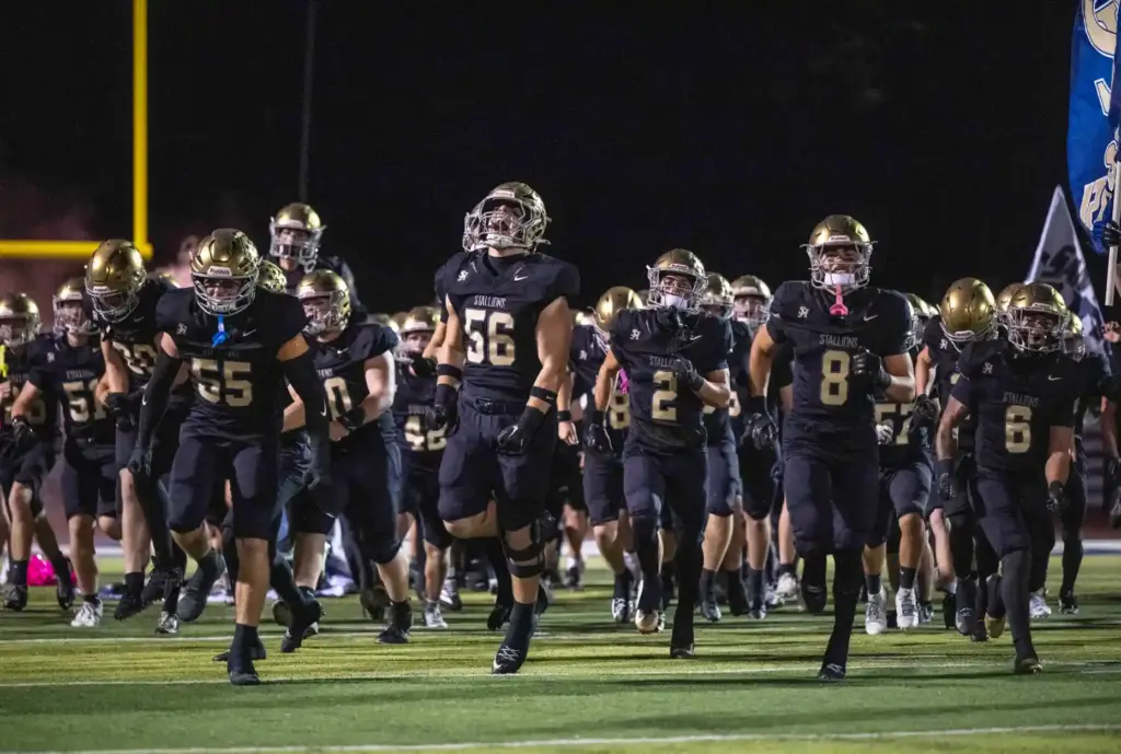 The San Juan Hills Stallions take the field for an...