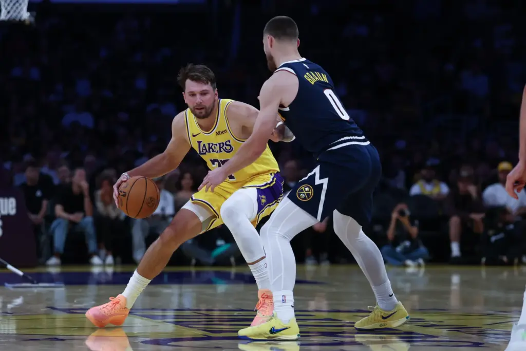Lakers guard Luka Doncic brings the ball up the court...