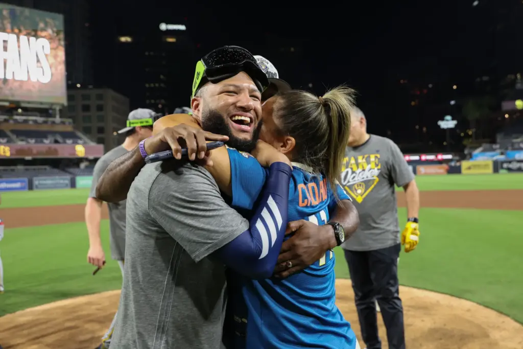 The Milwaukee Brewers’ Jackson Chourio celebrates with family members after...