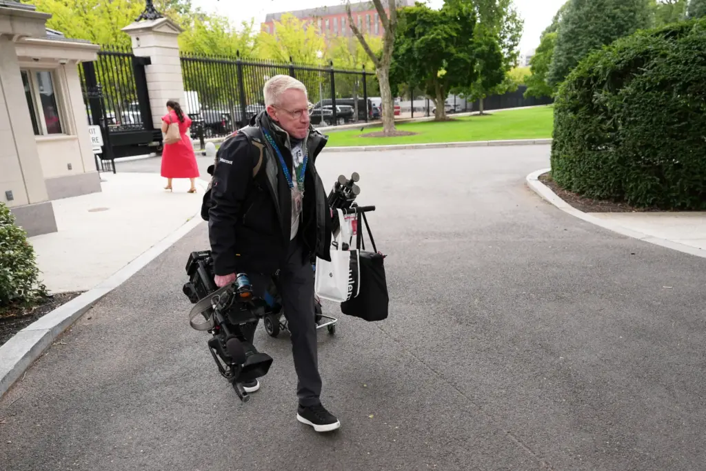 CNN senior photojournalist and contributing producer Peter Morris arrives on the White House grounds.