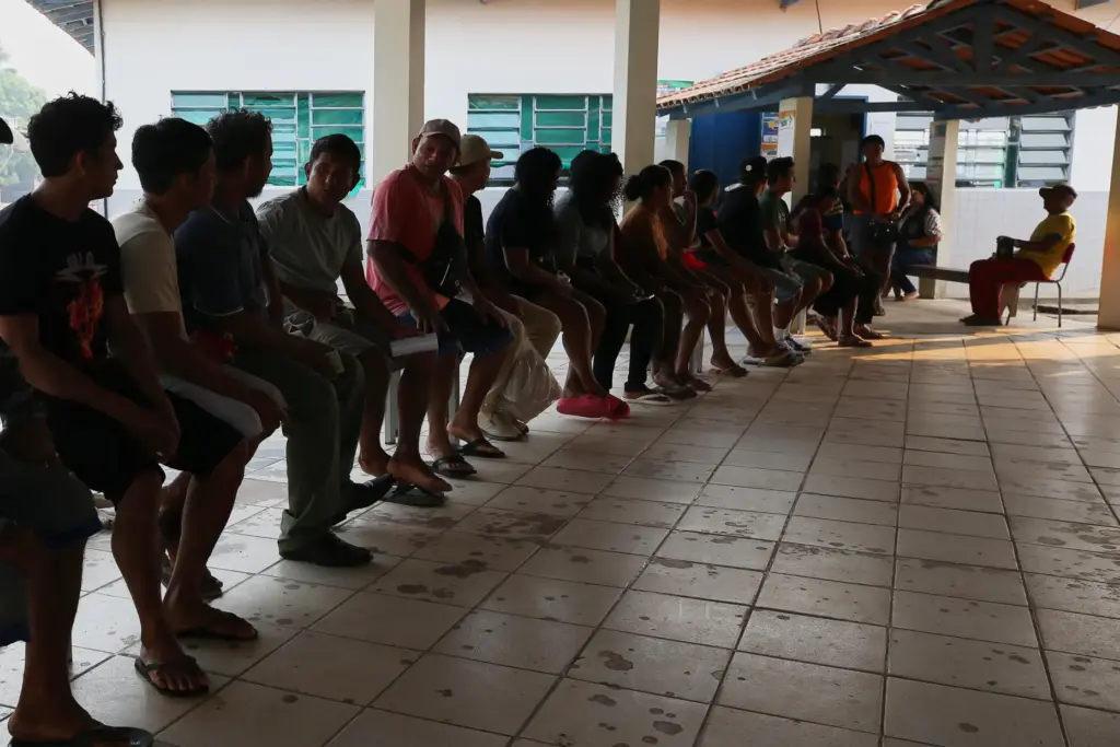FILE – Members of the Mura Indigenous community line up...