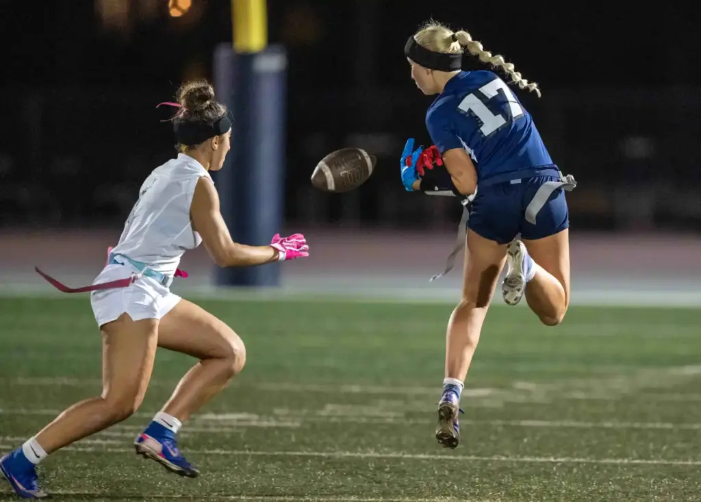 Corona del Mar defender Mia Balabanian (1), left, gets an...