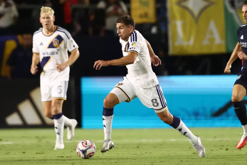 Los Angeles Galaxy midfielder Lucas Sanabria (8) controls the ball...